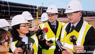 BP Photo - BTC Director Mike Townshend talks to the press at the Umbaki pipe yard during the first BTC pipe arrival in Baku. Jan. 28, 2003.