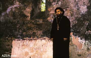 The Georgian priest who came to conduct a service at the Kish church while the archaeologists were excavating. It seems this may have been a long-standing tradition, even though there were no parishioners.