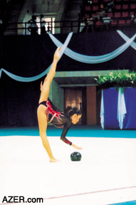 (Left) Azerbaijani Dinara Gimatova competes in the World Cup Rhythmic Gymnastics that were held in Baku in August. She took Third Place. Right: World Cup Rhythmic Gymnastics (2nd stage for 2003): 1st place: Alina Kabayeva, Russia; 2nd place: Irina Chashina, Russia; 3rd place (far right) Dinara Gimatova, Azerbaijan.