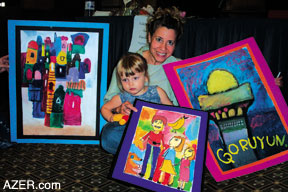 Judy Shifrin with her daughter Sabina and the art painted by Azerbaijani children that they selected at the Silent Auction.