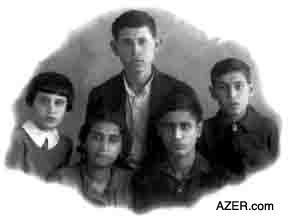 The four children that Ummugulsum Sadigzade left behind when she was sent into exile to Kazakhstan for eight years. The children were left in the care of her 21-year old niece Sayyara Rezayeva (1916-2002) seated here in the photo. Clockwise from left: daughter Gumral (1929- ), son Ogtay (1921- ), Toghrul (1926-1995), and Jighatay (1923-1947). Later both Ogtay and Jighatay were sent to hard labor camps since their father had been accused of being an "Enemy of the People". Jighatay did not survive the camps and died at the age of 24. Their father Seyid Husein was executed in 1938, but they didn't learn of his death until 18 years later.
