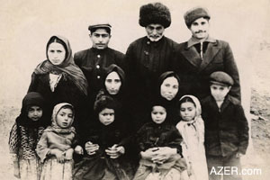Ahmad (standing far right) in 1956 after returning from prison in Siberia. Here he is with relatives from the village of Taghli. His brother Mammad is standing second from left. Ahmad's wife Zabita is the first woman seated on the left with little boy on her lap. Mammad's wife Zerkhanum is seated beside her. The children are from left to right: Gandaf, Narmina, Behruz, Azer, Kamala and Seyyad.