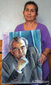 Sayyara Habibzade with a portrait of her late husband, Shukur (1922-2002). Sayyara was not aware that her husband had been writing his memoirs about his experiences as an 18-year-old university student who was arrested in 1942 and sentenced to eight years in prison. She found his writings in his archives after his death, edited them, and had them published as "Islah Evi" (Reformatory House) in 2003.