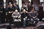 Yalta Conference, February 1945. Allied leaders pose in the courtyard of Livadia Palace, Yalta, during the conference. Those seated are (left to right): Prime Minister Winston Churchil (UK), President Franklin D. Roosevelt (USA), and Premier Joseph Stalin (USSR). From Army Signal Corps Collection in the U.S. National Archives.
