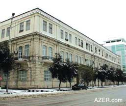 The infamous NKVD Building (Secret Police during Stalin's era). Originally built during the Oil Baron period at the turn of the 19th century, a five-story prison was built inside the inner courtyard. Author Shukur Habibzade describes the tortures that took place within the underground cells. The building is located in the center of Baku at the cross streets of Rashid Behbudov 1 and Azerbaijan Prospect. Today it houses the State Frontier Service (Dovlat Sharhad Khidmati). Top corner: Entrance to the building today. Photos: January snow, 2006.