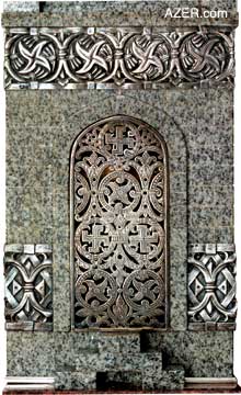 Decorative silver work on the sides of the clock.