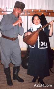 Tomoko performing on the traditional stringed instrument called saz, something that she learned in Azerbaijan as well.